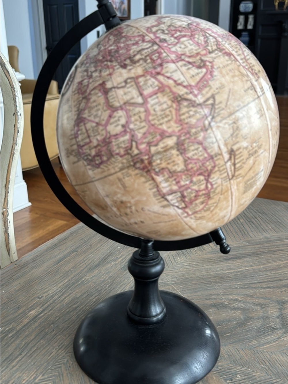 Antique-Style Beige and Pink Decorative Globe on Black Stand